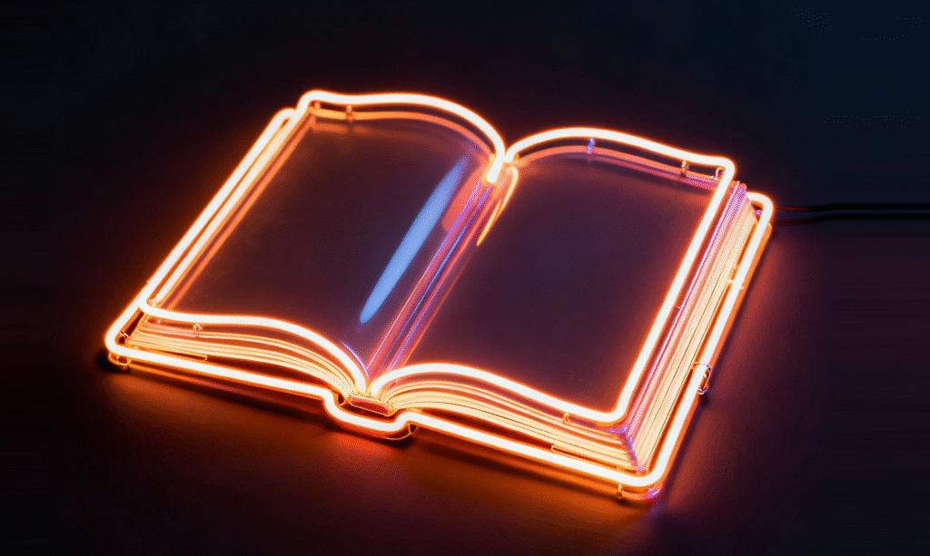 otwarta szklana książka otoczona neonem
